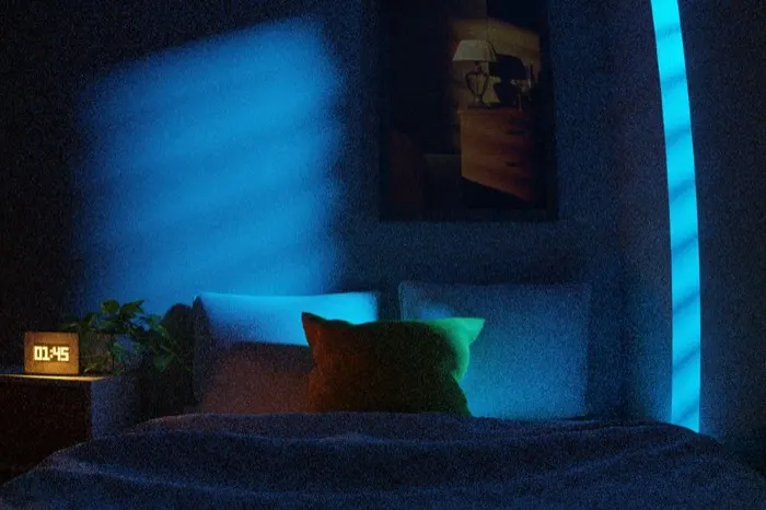 Bedroom at night lit by a window
