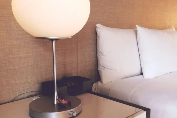 Hotel room bed and nightstand